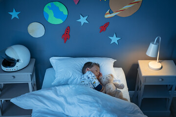 Wall Mural - Boy sleeping and dreaming a future in the space