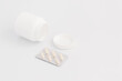 © Snizhana - Jar with pills and a blister on a white background. Flat lay.