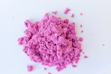 Kinetic Sand Of Pink Color On An Isolated White Background. Sand For Children's Creativity
