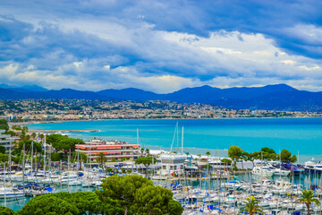 Landscape of the beautiful Marina Baie des Anges on against backdrop of Mediterranean Sea with yachts and sailboats. Villeneuve-Loubet. France.