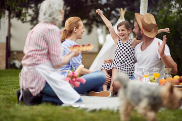 Wall Mural - Grandmother prepared cake for a family picnic