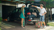 LENS FLARE: Husband loading suitcases into car sends his wife back in the house