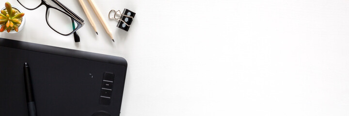 Fototapete - White copy space desk with a graphic tablet. Artist's desk. Office supplies. Home office. Art space. Panoramic photo.