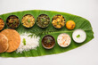 © StockImageFactory - South Indian style lunch or dinner meal or food served with a selection of recipes over banana leaf