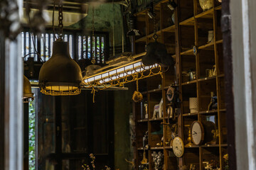 Wall Mural - Bangkok, Thailand - Jun 26, 2020 : Vintage Interior design house. Decoration of wooden wall shelves and old lamps. No focus, specifically.