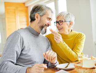 senior couple breakfast home food lifestyle eating table home man woman together husband wife family