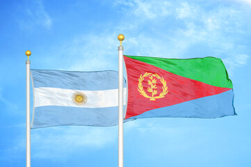 Argentina and Eritrea two flags on flagpoles and blue sky