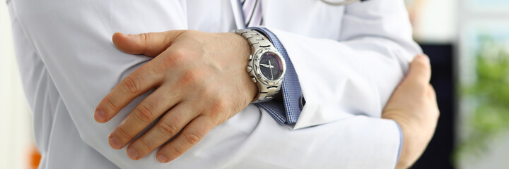 Wall Mural - Male medicine doctor hands crossed on his chest