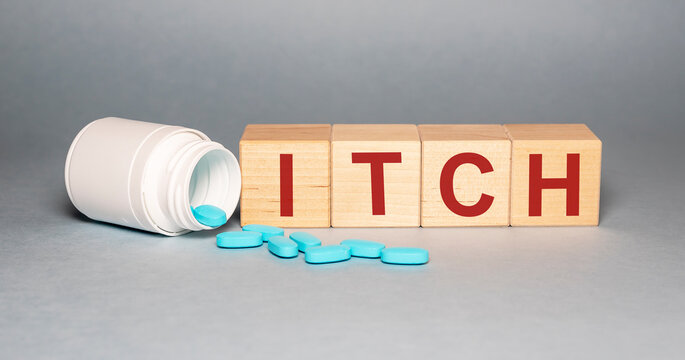 Itching, word cube with background. ITCH word inscription