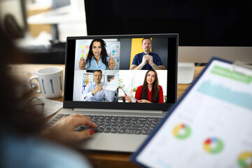 Woman talking with international colleagues using online video chat service