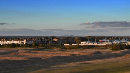 Wall Mural - Littlehampton in the evening sun looking over the links golf course towards the River Arun and the seaside town of Littlehampton.