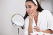 © ostap_davydiak - Skin care. Woman with beauty face touching healthy skin portrait.