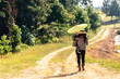 © Creative Flame - Mother and son walks along dirt country road