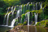 Fototapeta Morze - Waterfall landscape. Beautiful hidden waterfall in tropical rainforest. Nature background. Slow shutter speed, motion photography. Banyu Wana Amertha waterfall, Bali, Indonesia