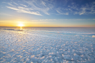 Wall Mural - Winter landscape. Ice blocks during the sunset.