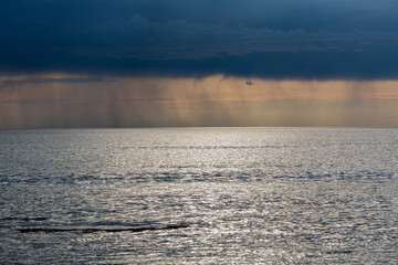 Wall Mural - Clouds before the rain in the sea