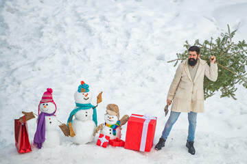 Canvas Print - Santa Claus with Christmas tree. Purchase and delivery of conifer on Christmas Eve. Christmas lumberjack with axe and Christmas tree.