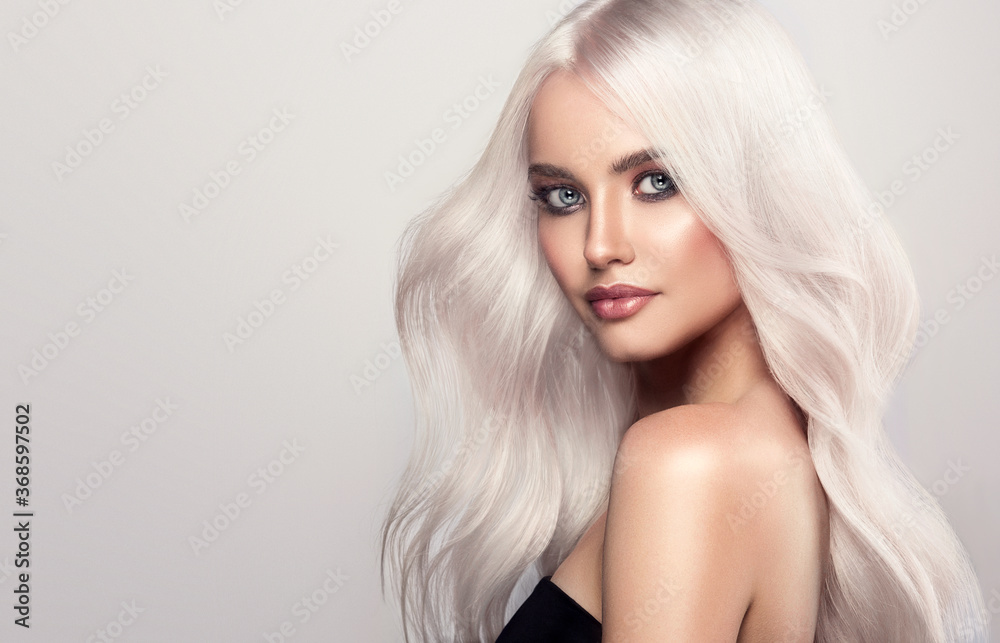  Beautiful girls with hair coloring in blond. Straight and smooth hair coloring in ultra blond color in a beauty salon. Beauty, cosmetics and makeup - obrazy, fototapety, plakaty 