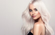 Leinwandbild Motiv  Beautiful girls with hair coloring in blond. Straight and smooth hair coloring in ultra blond color in a beauty salon. Beauty, cosmetics and makeup
