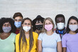 Group young people wearing face mask for preventing corona virus outbreak - Millennial friends with different age and culture portrait - Coronavirus disease and youth multi ethnic concept