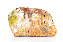Mildew On A Slice Of Bread. Old Loaf Of Bread, Covered With Mildew Isolated On White Background