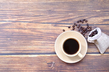 Wall Mural - cup of coffee on wooden table