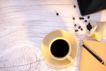 cup of coffee on wooden table