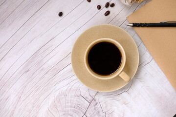 Poster - cup of coffee on a wooden table