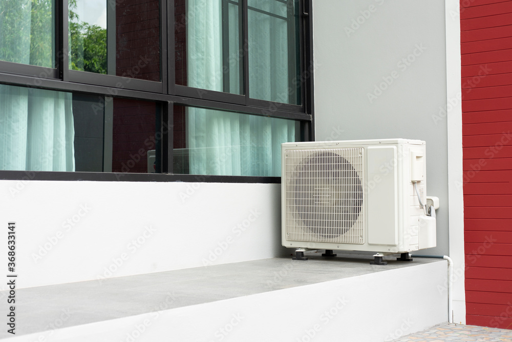 Air conditioner compressor on outdoor. Heavy duty unit of central air ...