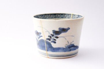 Wall Mural - Antique Japanese kintsugi soba cup restored with gold. Antique Kintsukuroi ceramic. 