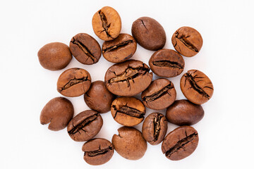 Roasted coffee beans close up isolated on white