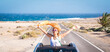 © simona - one young woman enjoying and having fun in their vacations outdoors - female person in freedom concept and lifestyle with a car in the middle of the road woth the ocean or sea at the background