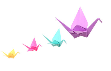 Wall Mural - origami cranes flying on white background