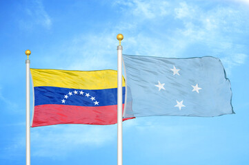 Venezuela and Micronesia two flags on flagpoles and blue sky