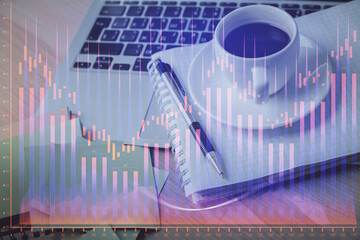 Double exposure of forex chart drawing and desktop with coffee and items on table background. Concept of financial market trading