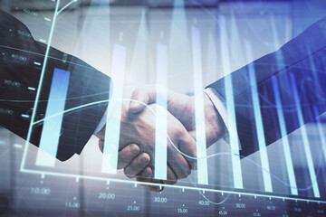 Double exposure of forex graph hologram and handshake of two men. Stock market concept.