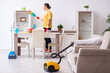 © Elnur - Young male contractor cleaning the house