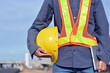 © Thongdee - Asian Engineer holding Yellow safety helmet in the factory