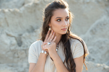 Wall Mural - woman showing off her jewelery in fashion concept wearing accessories and jewelry