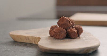 handmade chocolate truffles on a wood board