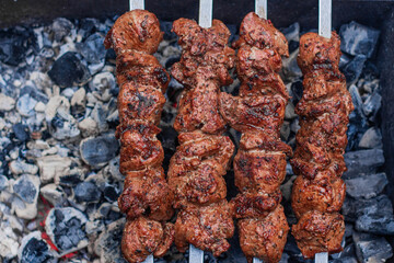 Wall Mural - Delicious flavorful shish kebab is prepared on the grill