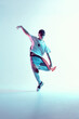 © Georgii - Boy dancing in neon light studio. Acrobatic dancer. Stylish flex.