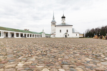 Wall Mural - Beautiful panoramic view of Suzdal in summer at sunrise. Resurrection Church on the market square in Suzdal. Suzdal is a famous tourist attraction and part of the Golden Ring of Russia