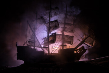 Black silhouette of the pirate ship in night