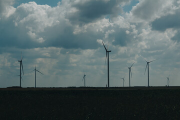 Windmill farm in the field on south of Ukraine.