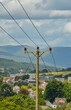 High-power electricity generators in Dumbarton. High voltage electric transmission towers.