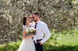 © Alisa - newlyweds near blooming trees