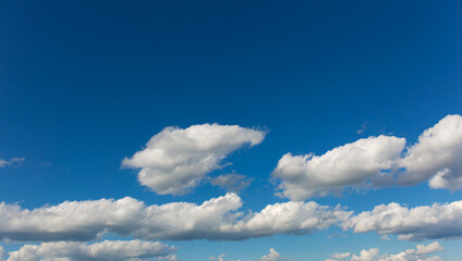 Wall Mural - Gray clouds on blue sky background.