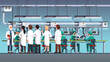 © iconicbestiary - Scientific engineers wearing lab coats at factory