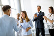 © BGStock72 - Young business partners making handshake in an office